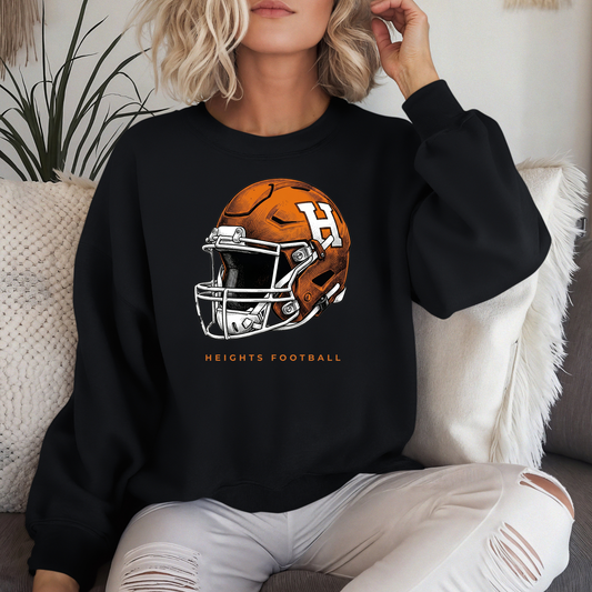 A person wearing a black crewneck sweatshirt with an orange and white Hamilton Heights football helmet design and 'HEIGHTS FOOTBALL' text.