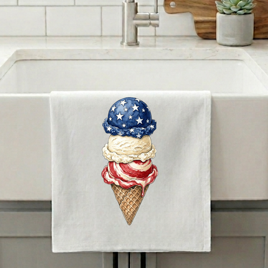 Kitchen towel with ice cream cone design featuring American flag colors hanging over a sink.