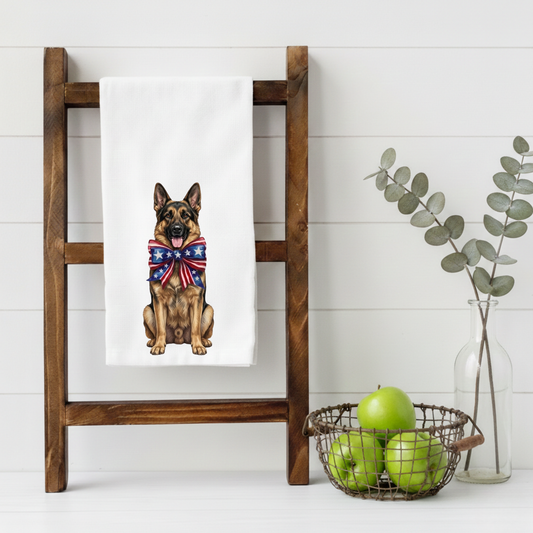 Towel with a German Shepherd dog design hanging on a wooden ladder against a white wall.
