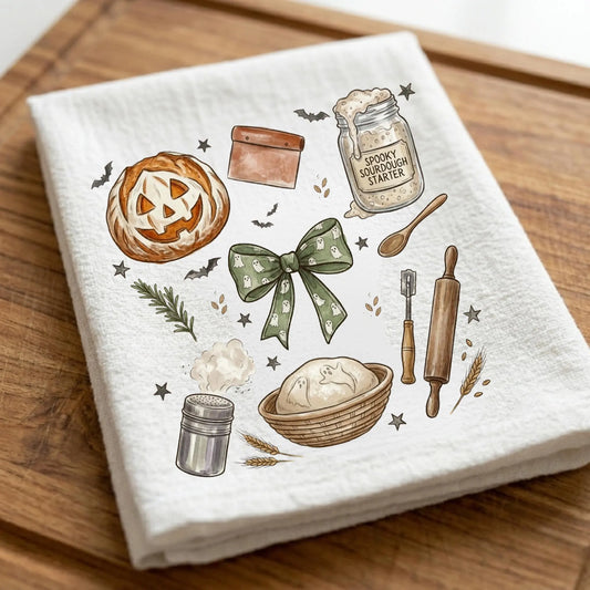 Spooky sourdough Halloween kitchen towel featuring pumpkin, sourdough starter jar, dough bowl, rolling pin and cottagecore baking artwork