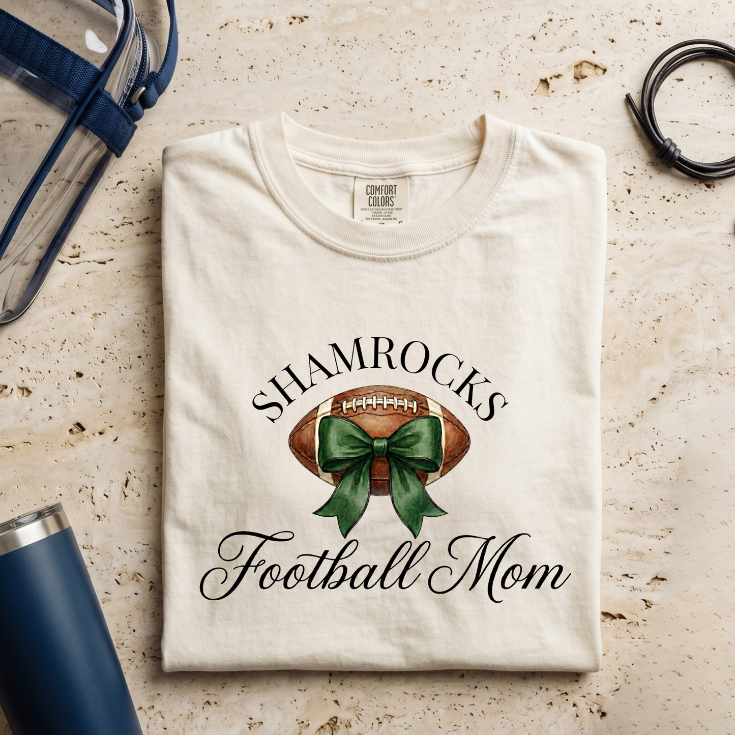 Folded Westfield Shamrocks Football Mom Coquette Bow Tee featuring football bow graphic and game day spirit wear design