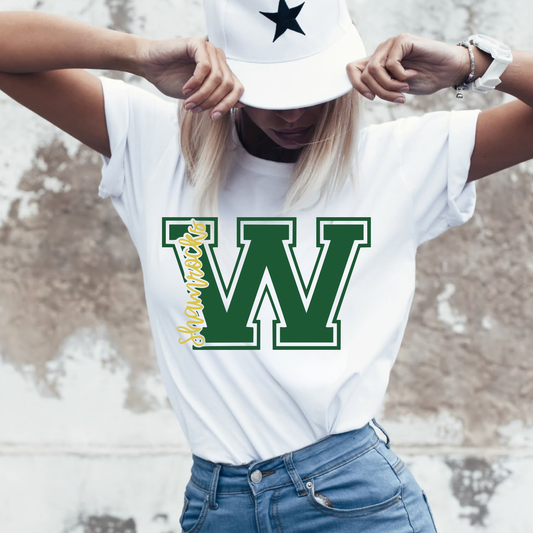 Woman wearing a Westfield Shamrocks Varsity W graphic tee on white Comfort Colors shirt featuring green and gold school spirit design