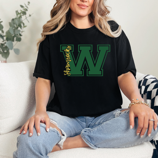 Woman wearing a Westfield Shamrocks Varsity W shirt on black Comfort Colors tee featuring green varsity letter W with Shamrocks script