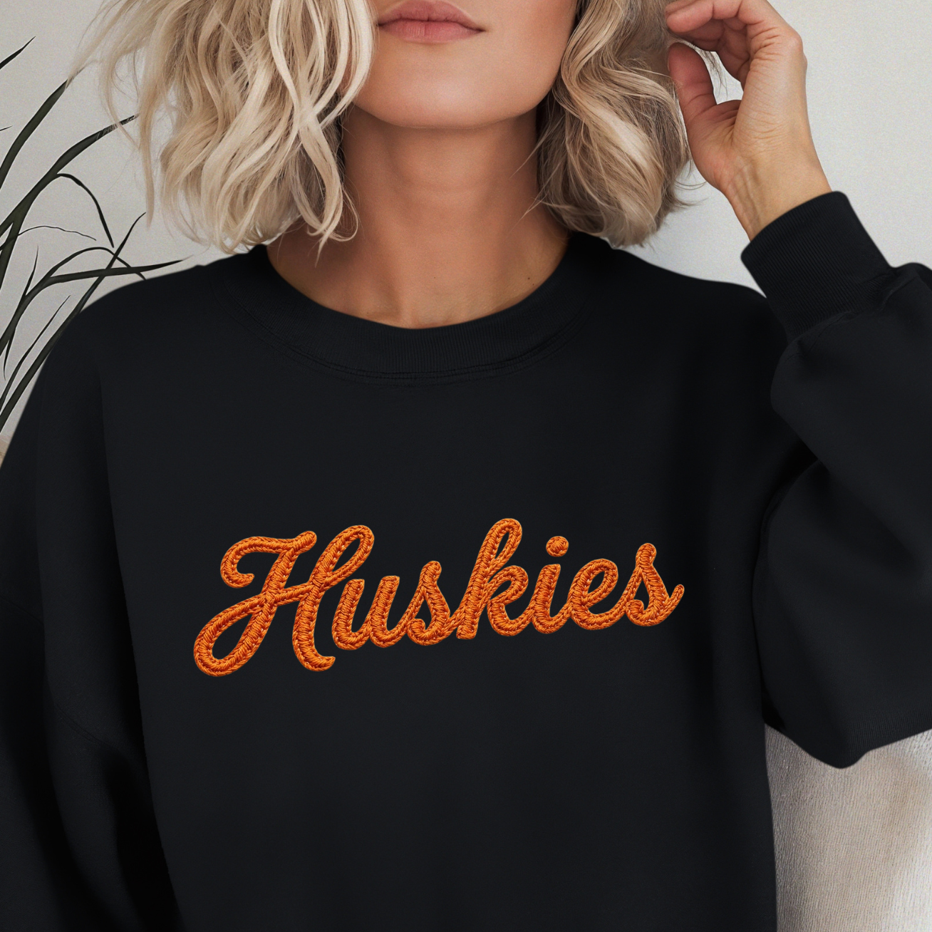 Huskies faux embroidery script design featuring realistic vintage stitching effect and retro athletic style lettering