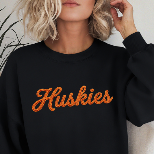 Huskies faux embroidery script design featuring realistic vintage stitching effect and retro athletic style lettering