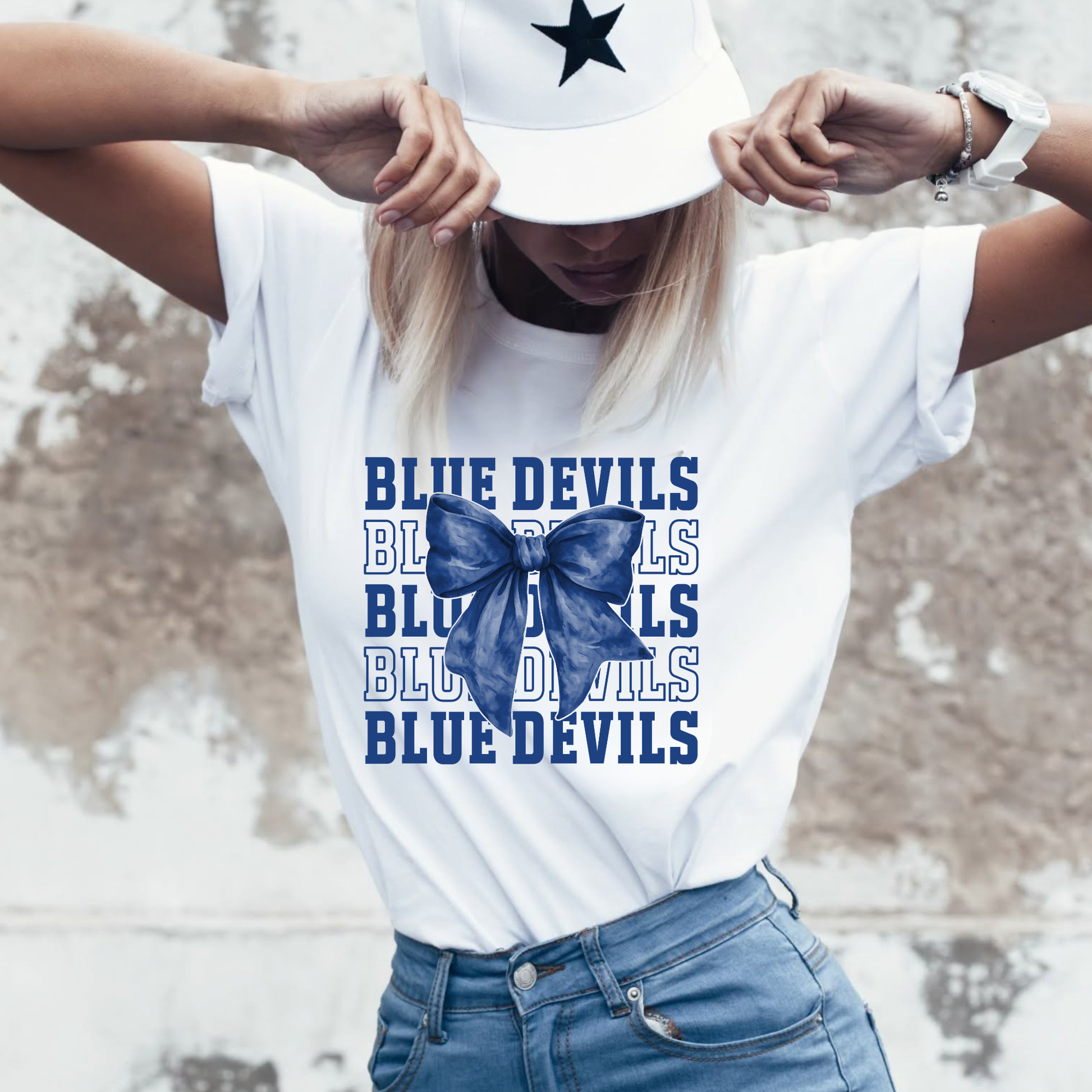 Tipton Blue Devils coquette bow graphic tee featuring layered varsity typography and blue bow design on white Comfort Colors shirt
