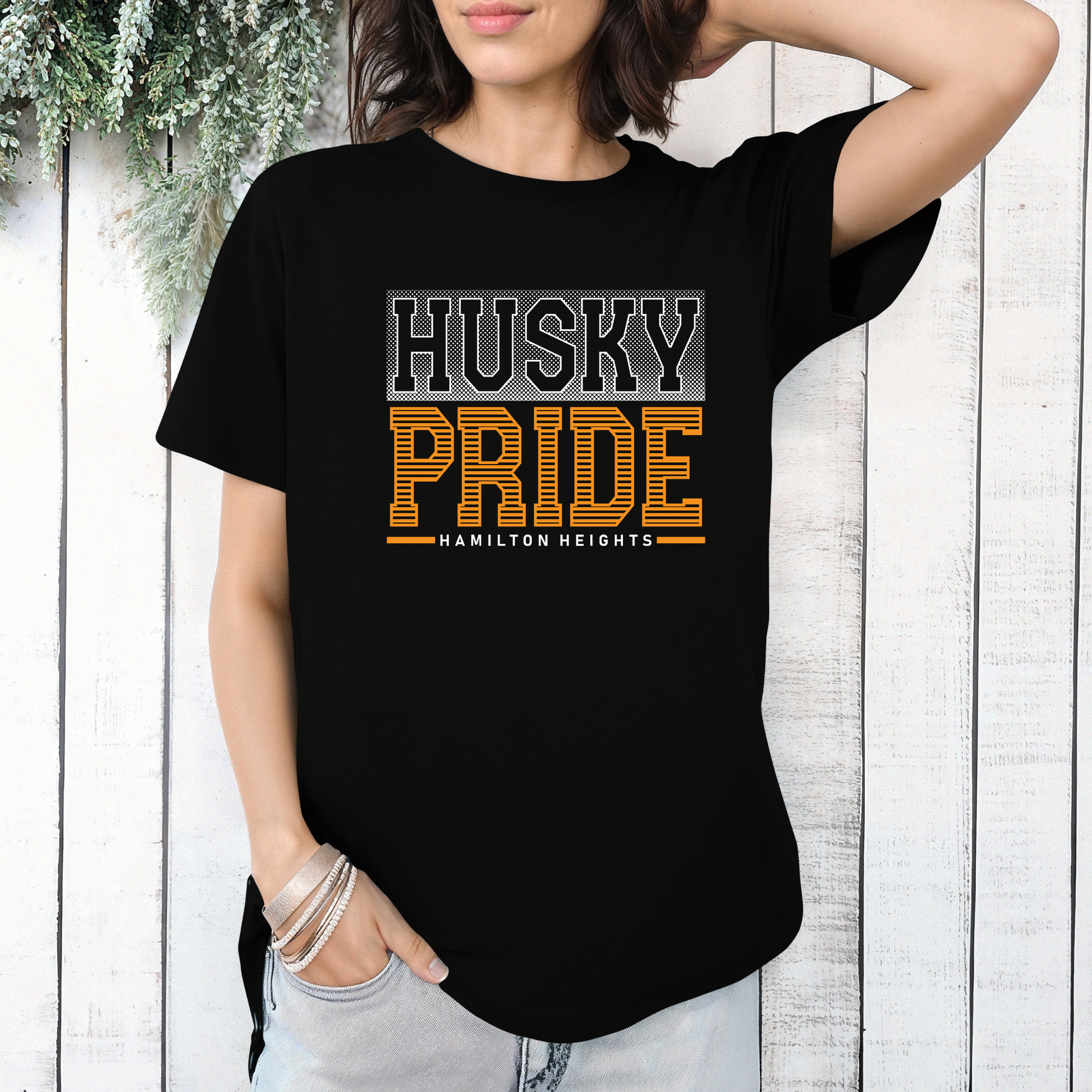 Woman wearing Hamilton Heights Husky Pride spirit wear shirt with varsity-inspired Huskies graphic and school color accents