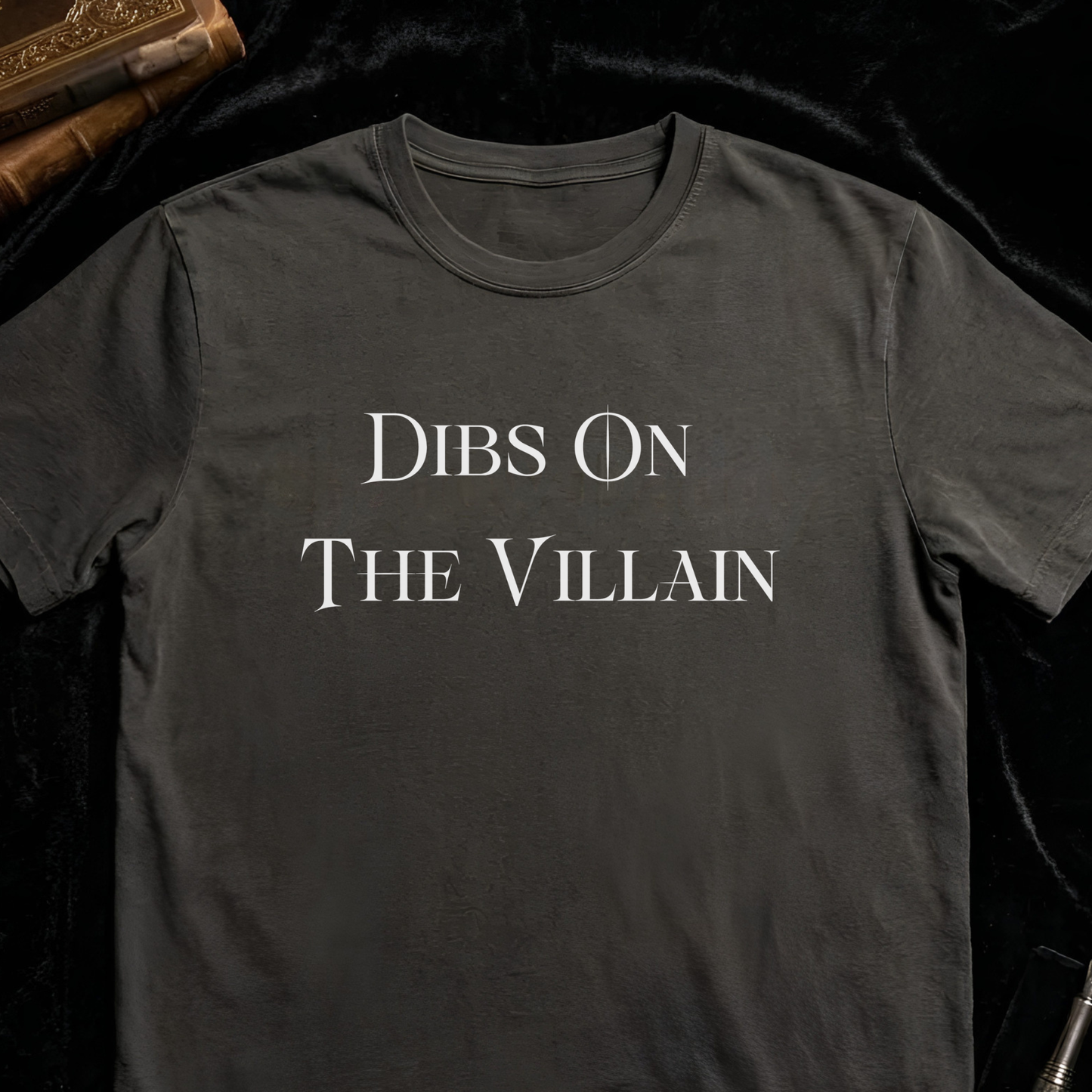 Charcoal Comfort Colors shirt featuring Dibs On The Villain typography design for dark romance readers