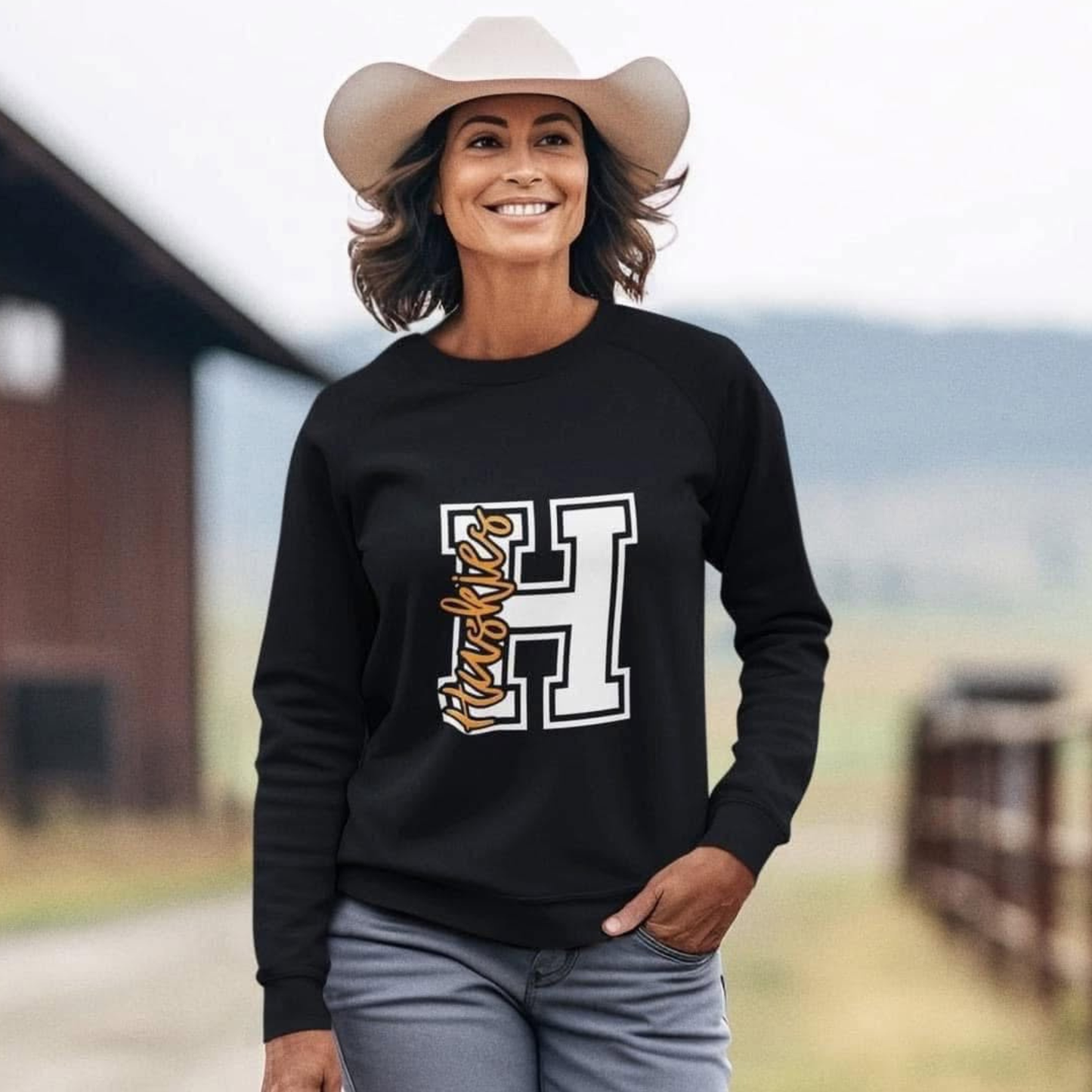Hamilton Heights Huskies Varsity H crewneck sweatshirt featuring large collegiate letter H graphic with Huskies script overlay on black Gildan sweatshirt