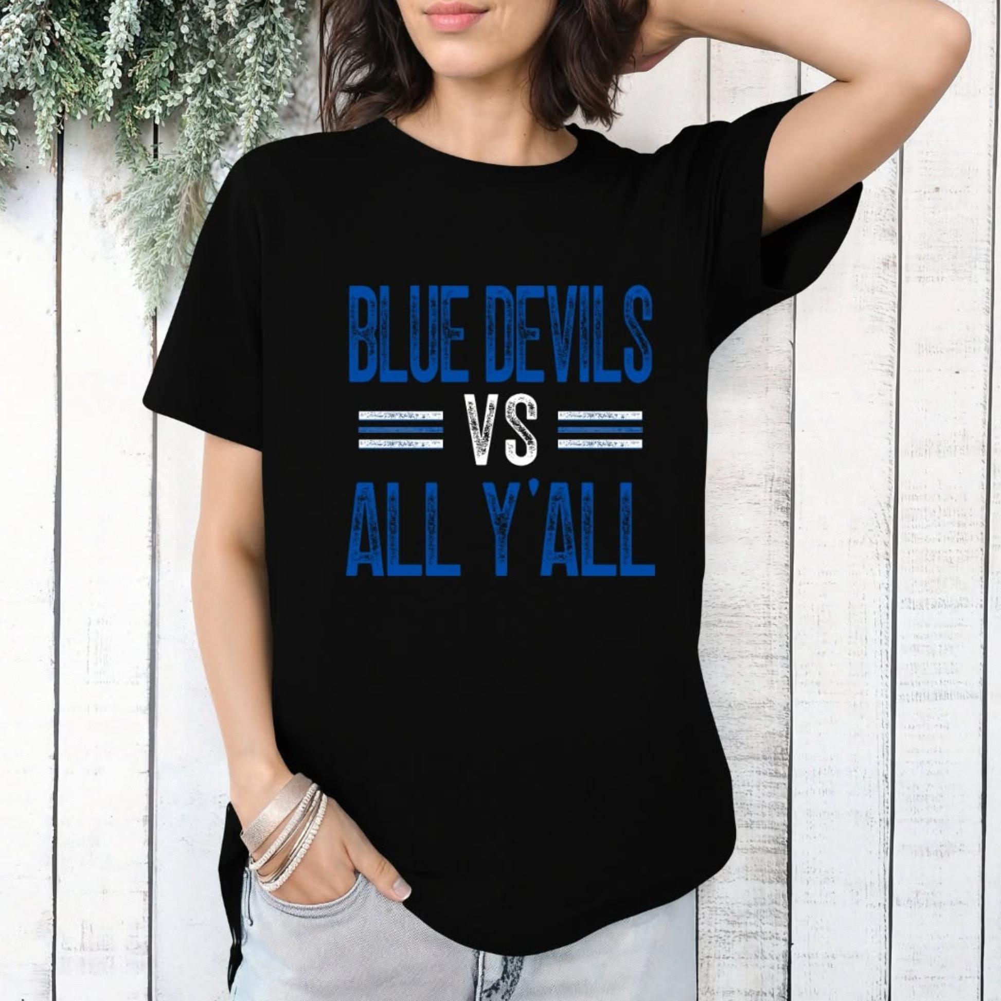 Person wearing a black t-shirt with 'Blue Devils vs All Y'all' text.