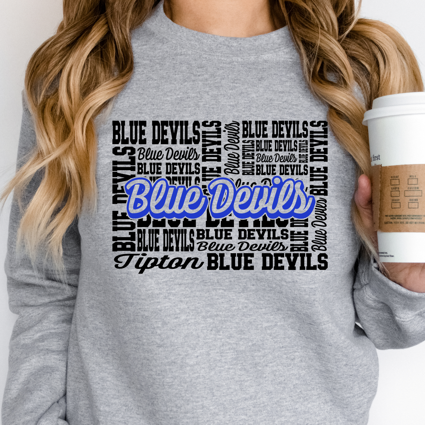 Woman wearing Tipton Blue Devils hometown spirit wear crewneck sweatshirt