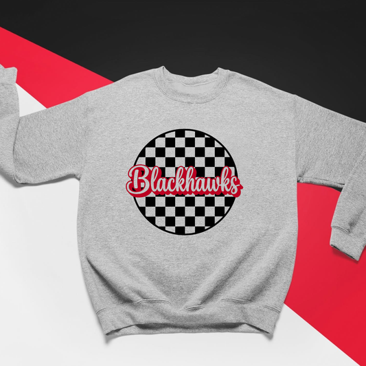 Close-up of Sheridan Blackhawks checkered sweatshirt with red script school spirit graphic and checkerboard pattern