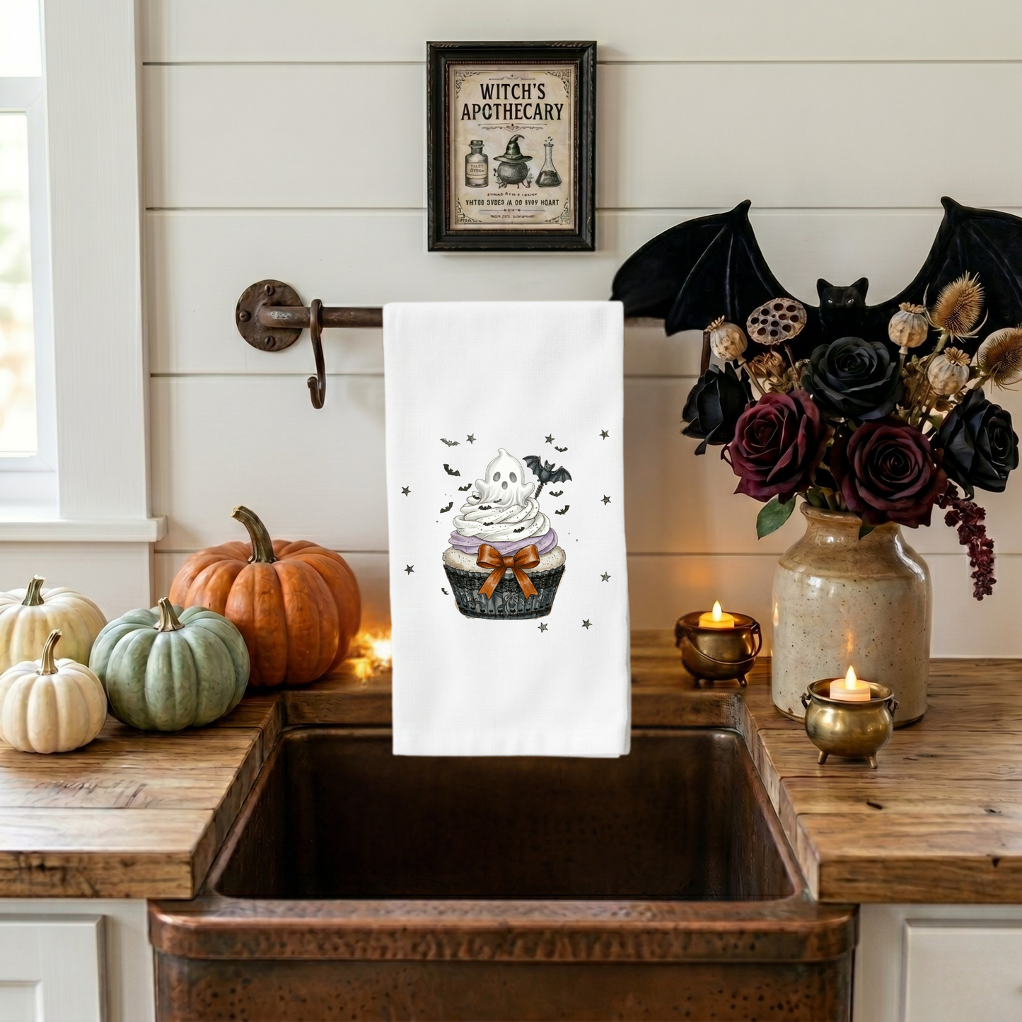 Cute Halloween kitchen towel featuring a ghost cupcake design displayed on a copper farmhouse sink