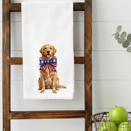 Towel with a Golden Retriever dog wearing an American flag bow tie hanging on a wooden ladder.
