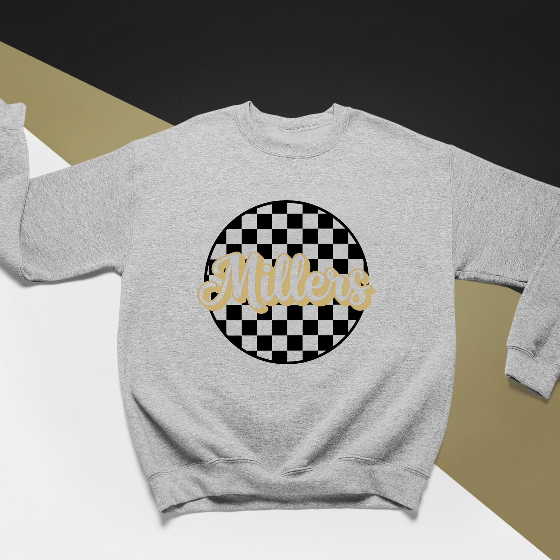 Noblesville Millers Checkered Crewneck Sweatshirt featuring a black and gold checkered circle design with Millers script for school spirit wear.