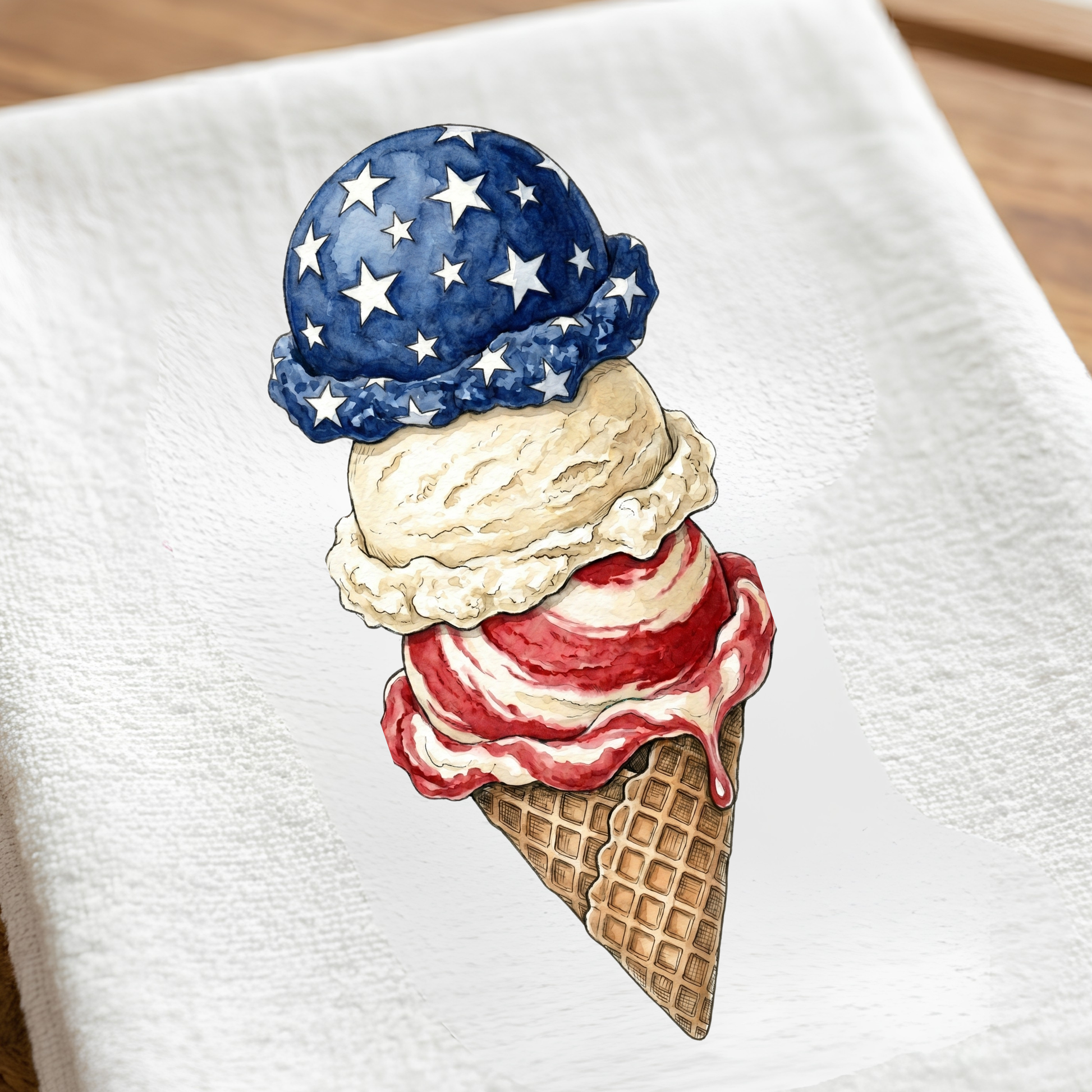 Ice cream cone with patriotic top on a white kitchen towel