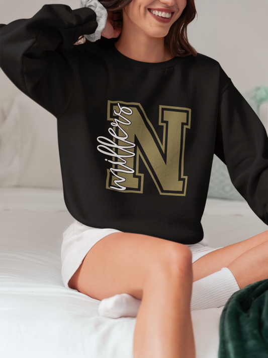Woman wearing a black Noblesville Millers varsity letter N crewneck sweatshirt.