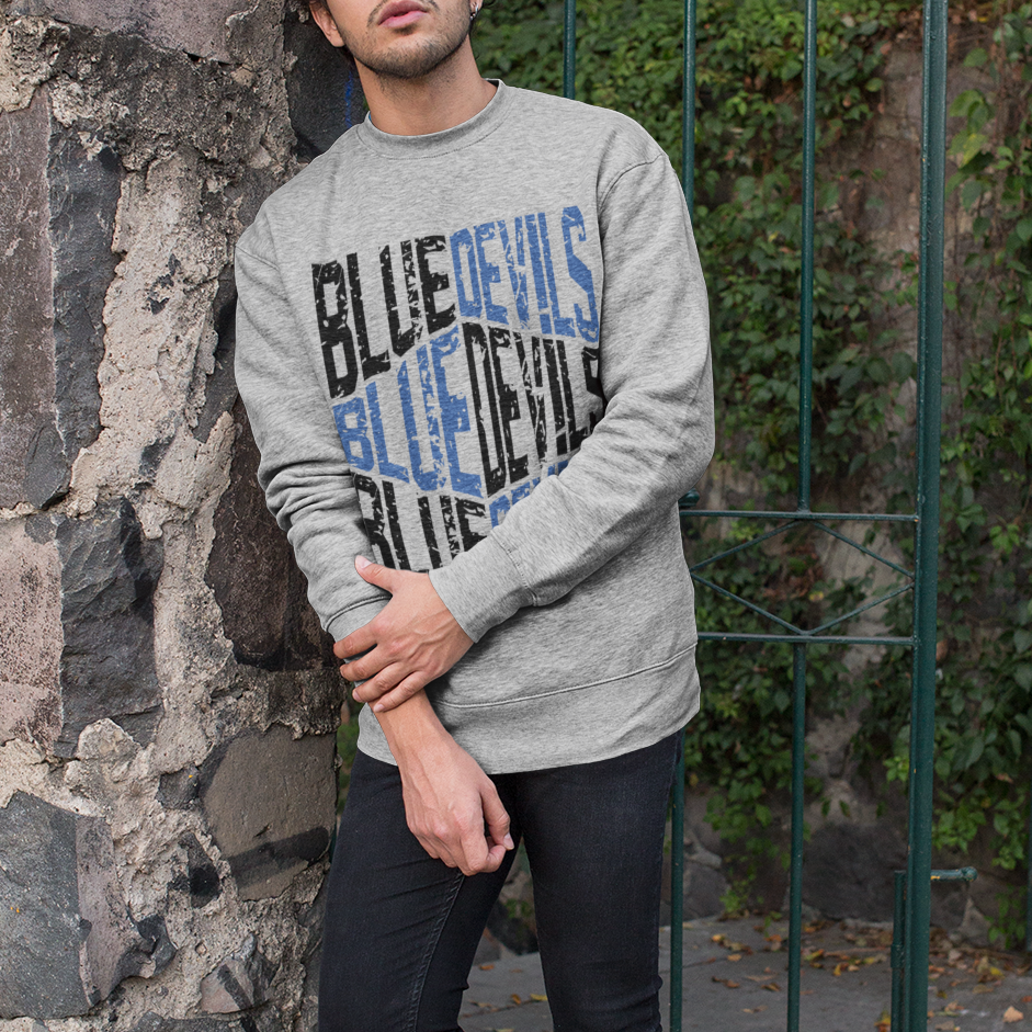 Man wearing a Heather gray crewneck sweatshirt with distressed Tipton Blue Devils design