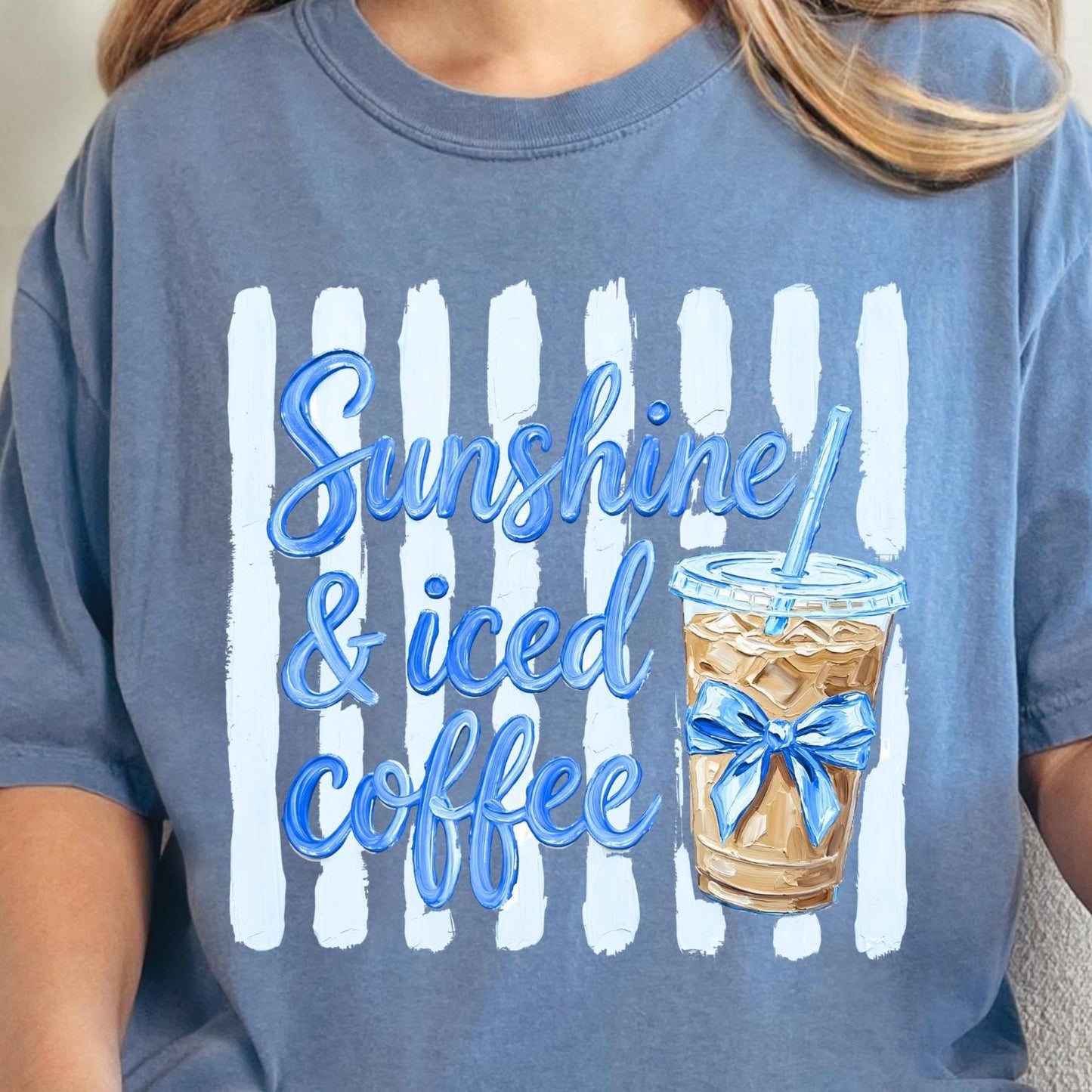 Blue t-shirt with 'Sunshine & iced coffee' text and iced coffee graphic.