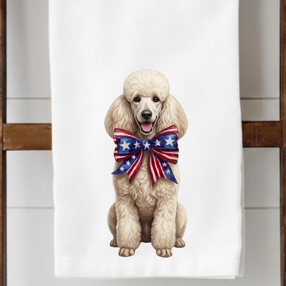Towel with a poodle wearing an American flag bow tie on a white background