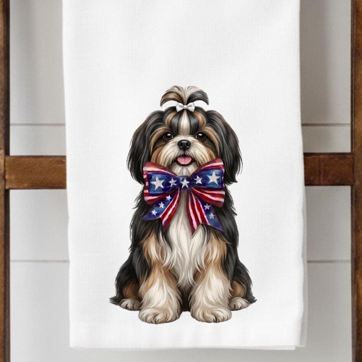 Towel with a dog wearing an American flag bow tie on a white background