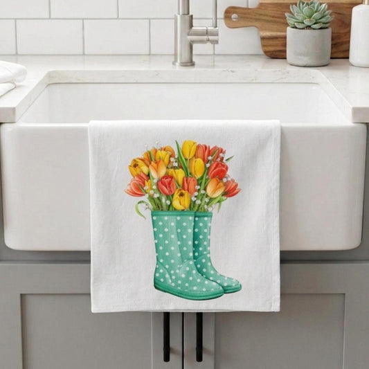 Kitchen towel with floral design hanging over a sink