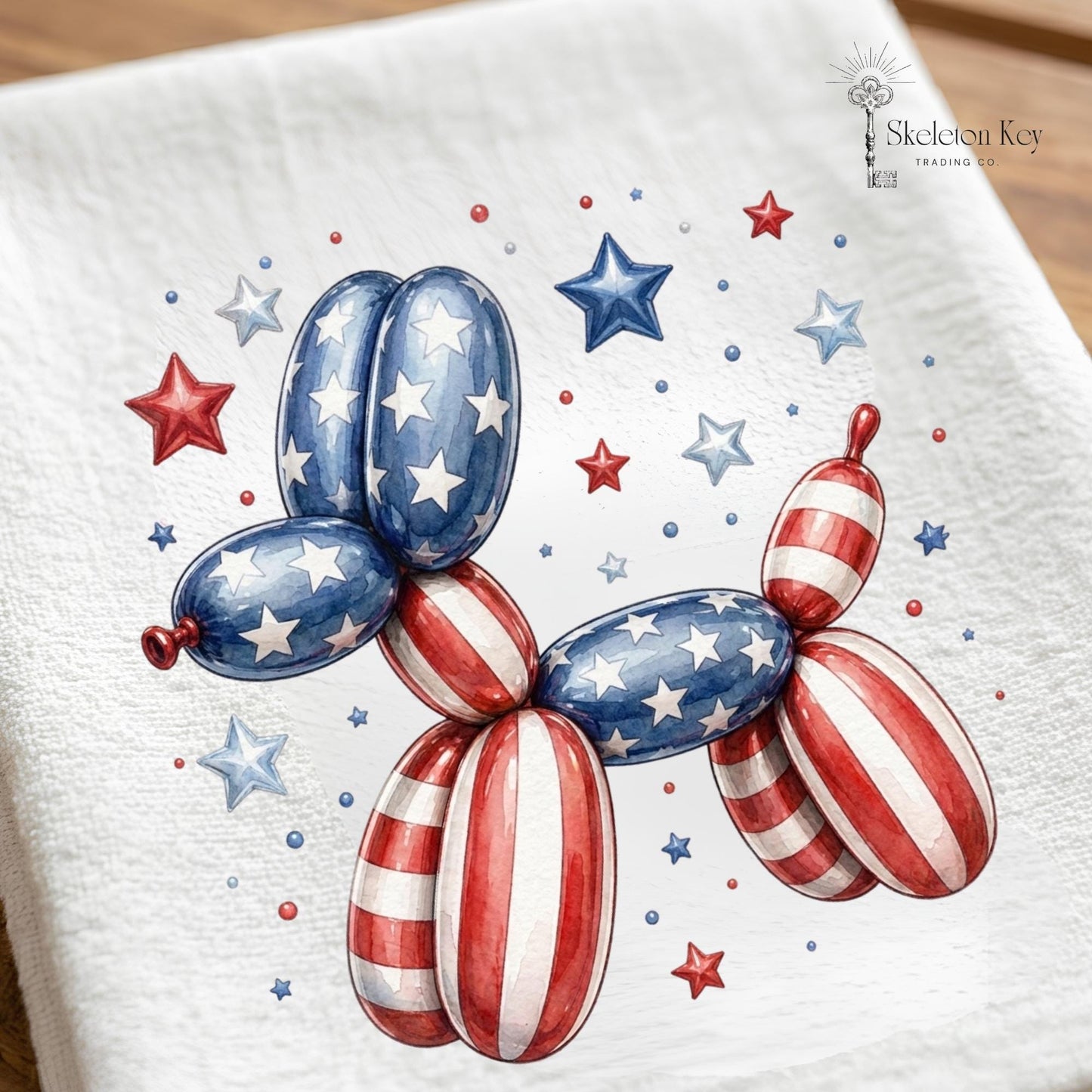 Decorative towel with a patriotic balloon dog design featuring stars and stripes on a white background.