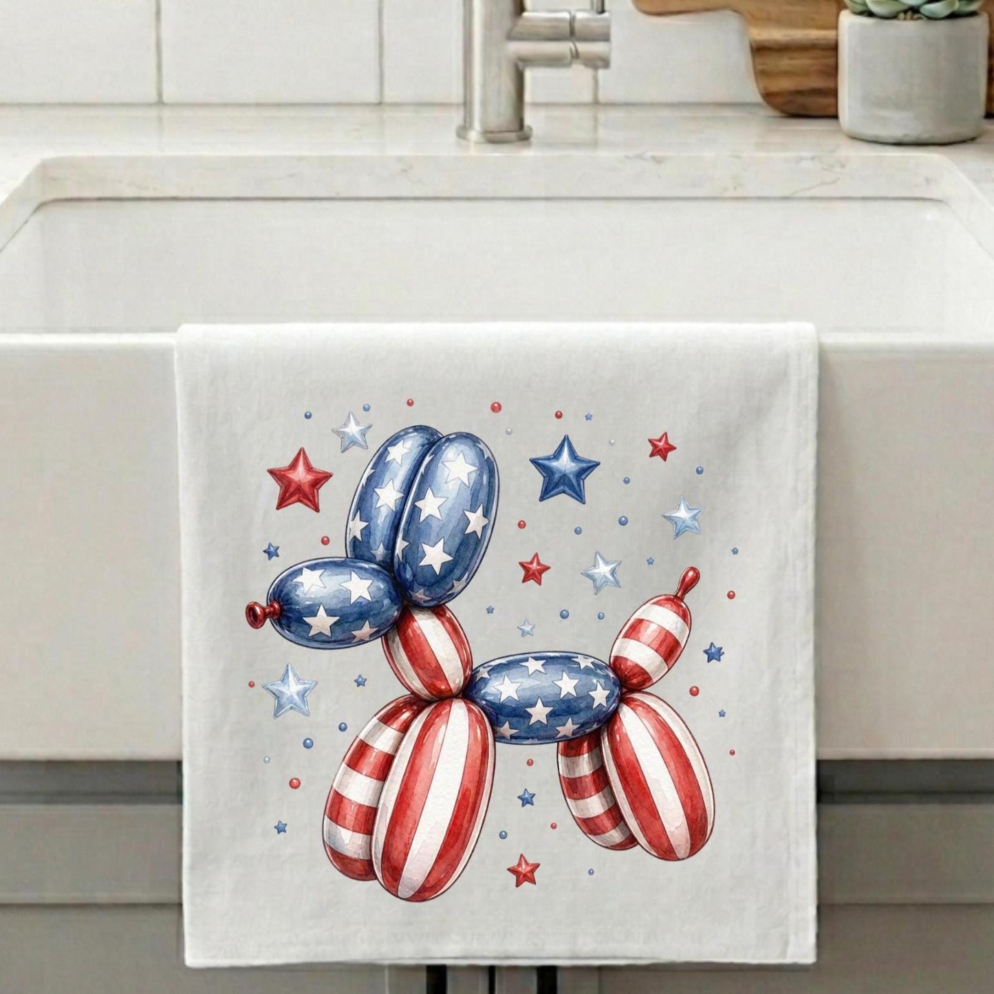 Kitchen towel with patriotic balloon dog design on a kitchen counter.