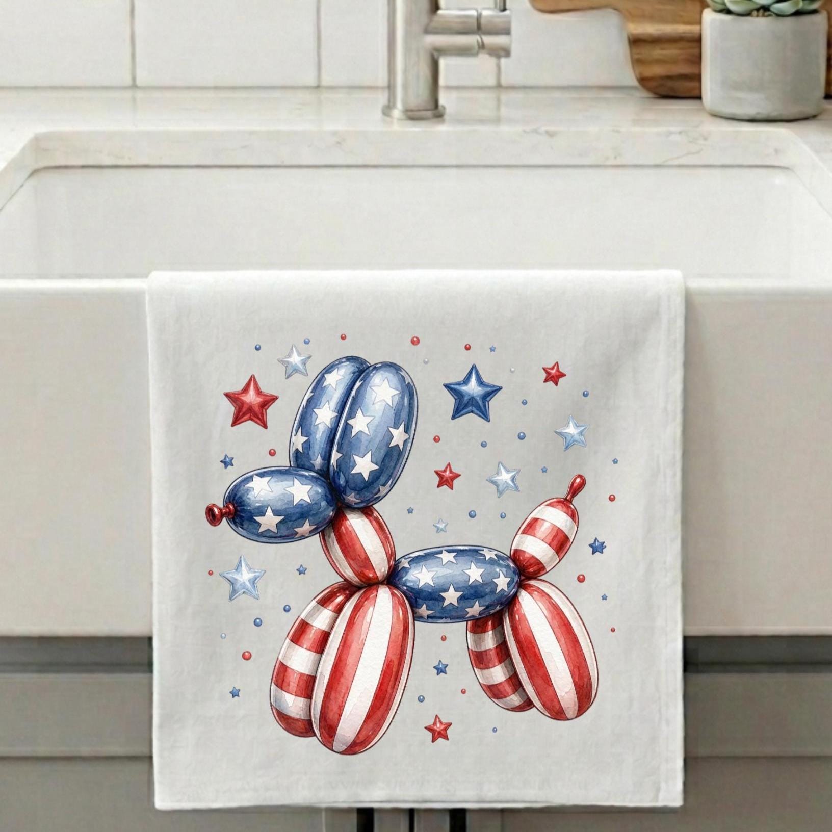 Kitchen towel with patriotic balloon dog design on a kitchen counter.