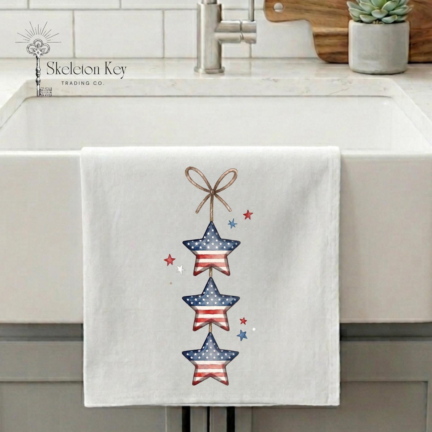 Towel with star design hanging on a kitchen sink