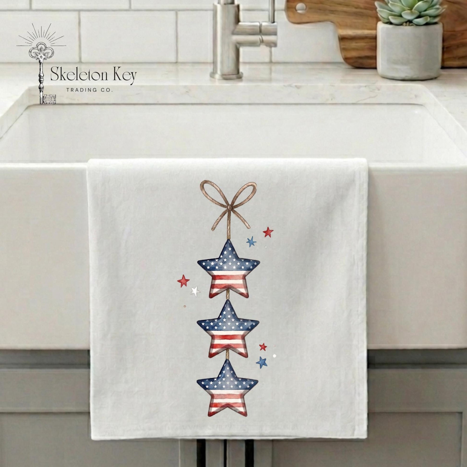 Towel with star design hanging on a kitchen sink