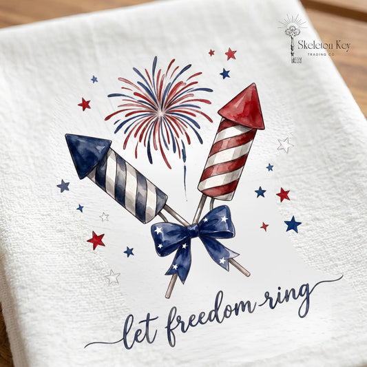 Let Freedom Ring kitchen towel featuring patriotic fireworks and red white blue rockets with Americana design