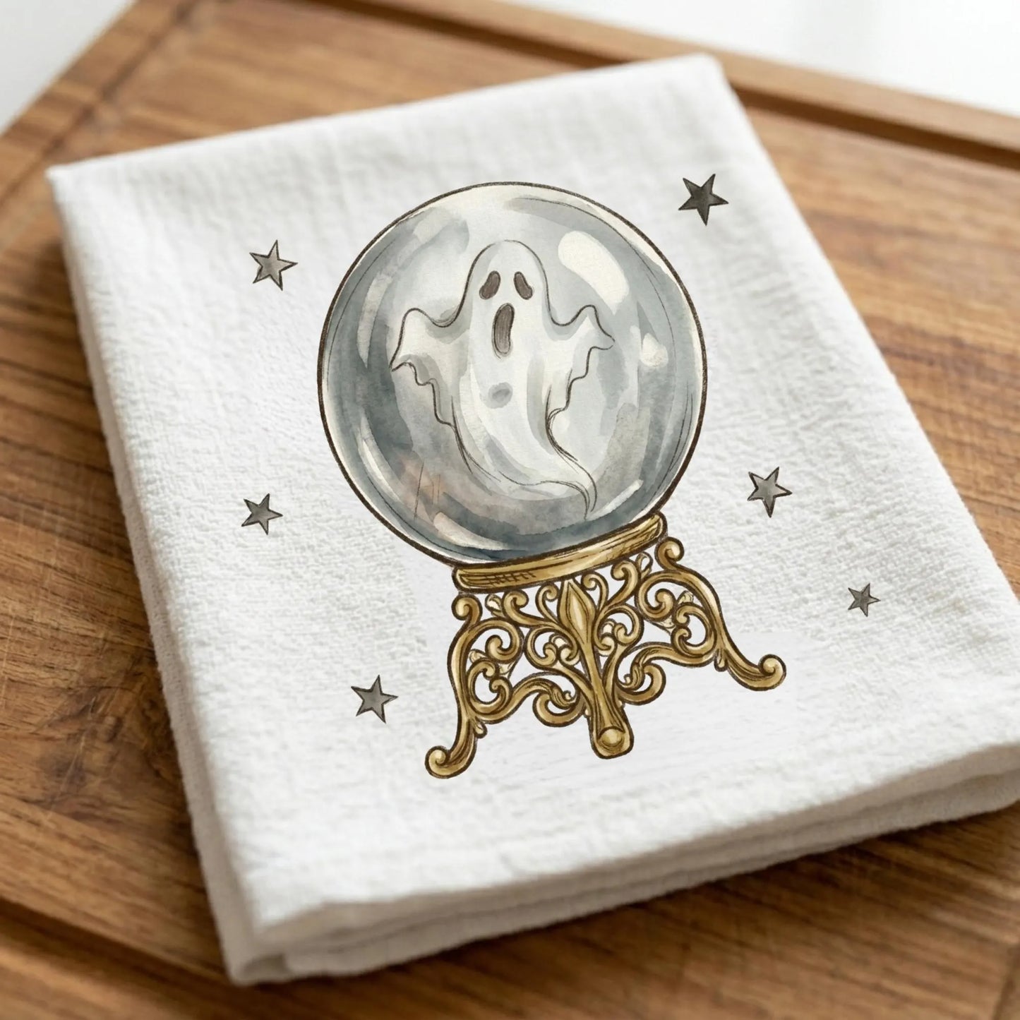 Ghost crystal ball tea towel featuring watercolor ghost inside vintage crystal ball with stars and Halloween details