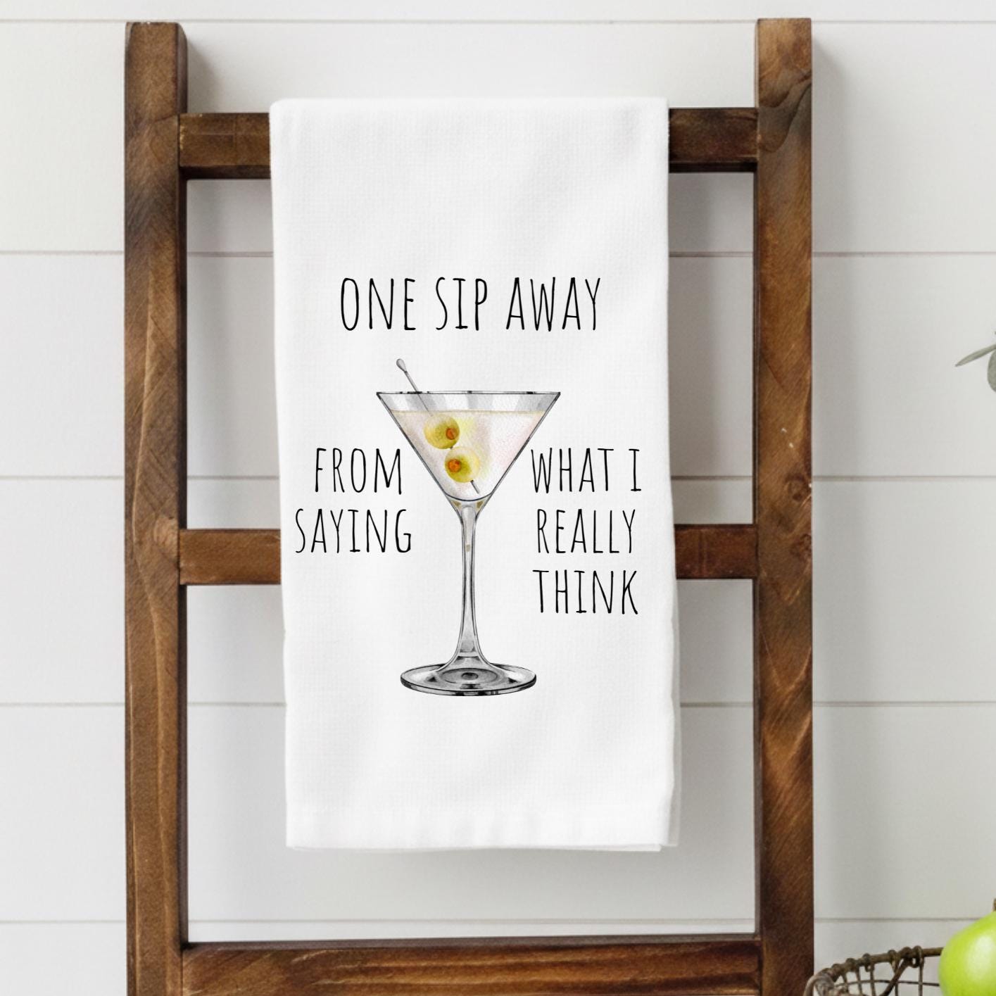 Martini glass illustration with One Sip Away From Saying What I Really Think saying on decorative kitchen towel