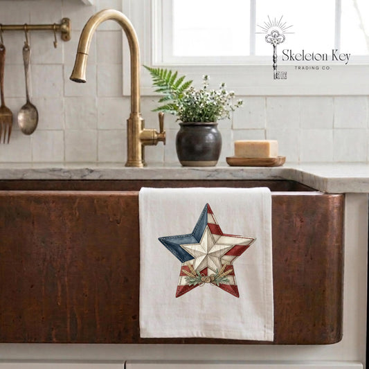 Patriotic barn star kitchen towel featuring a rustic red white and blue patchwork star design with Americana farmhouse styling