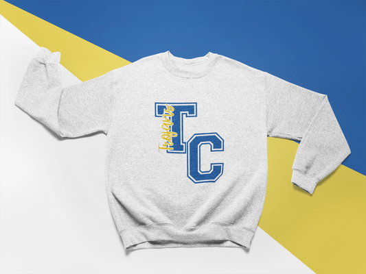 Sport grey Tri-Central Trojans varsity TC crewneck sweatshirt laid flat on a color block background 
